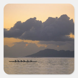 An outrigger canoe team practices off the coast square sticker
