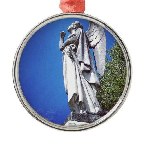 Angel and a bright blue sky metal ornament