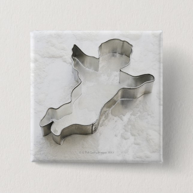 Angel shaped cookie cutter, with flour, close-up pinback button (Front)