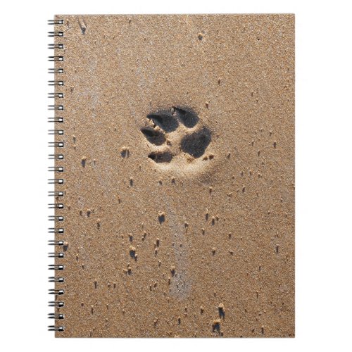 Animal paw prints in sand notebook