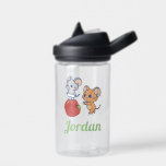 Anime Tuffy and Jerry Apple Rolling Water Bottle<br><div class="desc">This charming anime graphic captures a delightful moment shared between the two famous mice from "Tom and Jerry." Tuffy walks triumphantly atop a giant, glossy apple, while Jerry pushes the apple along with excitement, perhaps suggesting a playful game or a shared snack. Their expressions are full of joy and mischief,...</div>