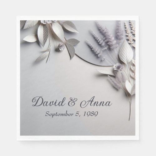 Anniversary Metallic Paper Flowers On Silver Napkins