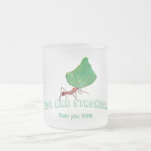 Ant carrying a big leaf frosted glass coffee mug