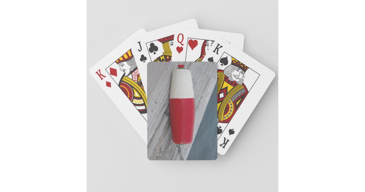 Antique fishing bobber, red white and green playing cards