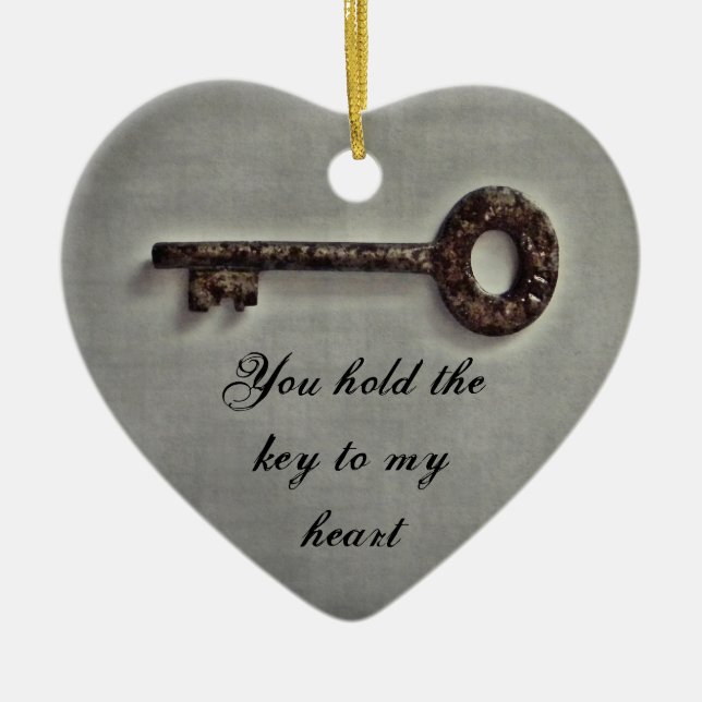 Antique key on gray ceramic ornament (Front)