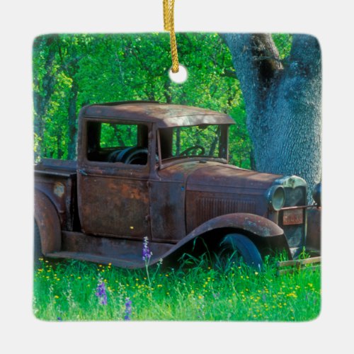 Antique rusted truck in a meadow ceramic ornament