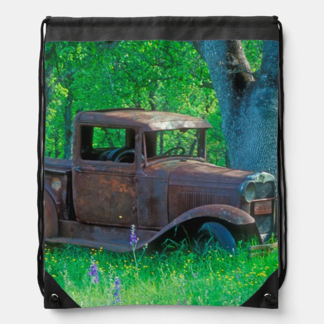 Antique rusted truck in a meadow drawstring bag (Front)