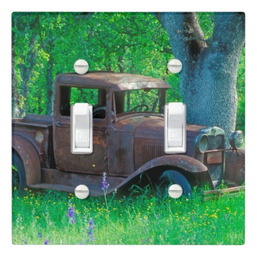 Antique rusted truck in a meadow light switch cover