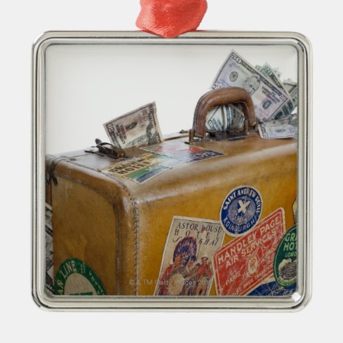 Antique suitcase with protruding money metal ornament