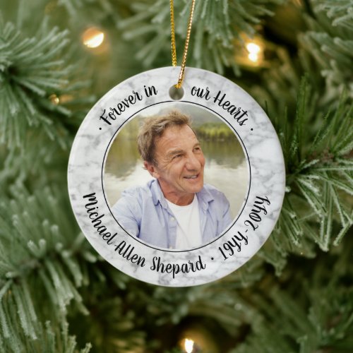 Any Text 2 Photo Memorial Elegant Faux Marble Ceramic Ornament - Honor a departed loved one for the holidays with a custom photo round faux marble ceramic Christmas ornament. All text and images on this template are simple to personalize and can be different or the same on front and back. "Forever in our hearts" can be changed to "in loving memory of," "an angel in heaven" or other wording. (IMAGE PLACEMENT TIP: An easy way to center a photo exactly how you want is to crop it before uploading to the Zazzle website.) The design features a black and white faux marble border, minimalist handwritten style script typography and two pictures of your choice. This unique & modern sympathy keepsake makes a thoughtful funeral remembrance gift idea and adds a stylish touch to Xmas home decorations. It's an elegant way to pay tribute to a family member or friend who has passed away.