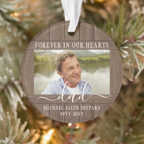 Any Text 2 Photo Memorial Simple Rustic Faux Wood Ornament - Honor a departed loved one for the holidays with a custom photo faux wood round acrylic Christmas ornament. All text and images on this template are simple to personalize. "Forever in our hearts" can be changed to "in loving memory of," "an angel in heaven" or other wording. (IMAGE PLACEMENT TIP: An easy way to center a photo exactly how you want is to crop it before uploading to the Zazzle website.) The modern farmhouse style design features a rustic brown faux wood border, elegant handwritten style script calligraphy, typewriter typography name and years, and two images of your choice. This unique & modern sympathy keepsake makes a thoughtful funeral remembrance gift idea and adds a stylish touch to Xmas home decorations. It's an elegant way to pay tribute to a family member or friend who has passed away.
