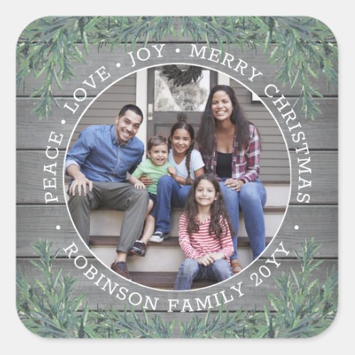 Any Text Photo Modern Farmhouse Greenery Grey Wood Square Sticker - Add a stylish finishing touch to holiday card envelopes and Christmas gifts with these custom photo modern farmhouse style square stickers. All text on this template is simple to customize to include any wording, such as Merry Christmas, Happy Holidays, Seasons Greetings, New Year Cheers etc. (IMAGE PLACEMENT TIP:  An easy way to center a photo exactly how you want is to crop it before uploading to the Zazzle website.) As an option, change text to name and address for use as chic square return address envelope seals. Design features a rustic grey wood background, festive watercolor pine greenery,  minimalist typography, and one picture of your choice.