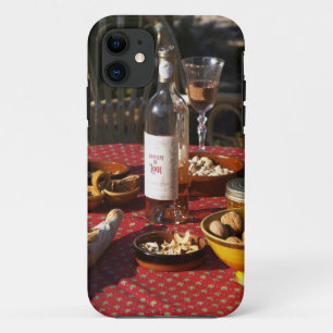 Aperitif and appetizers prepared: bread, olives, iPhone 11 case