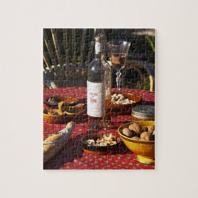 Aperitif and appetizers prepared: bread, olives, jigsaw puzzle (Vertical)