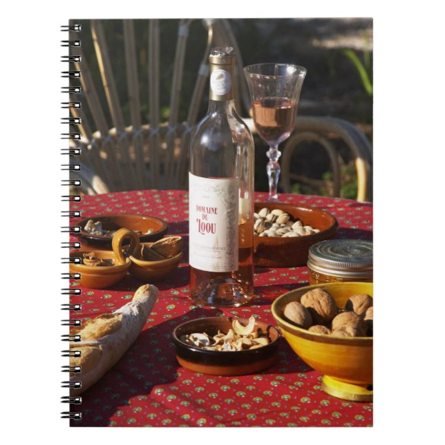 Aperitif and appetizers prepared: bread, olives, notebook (Front)