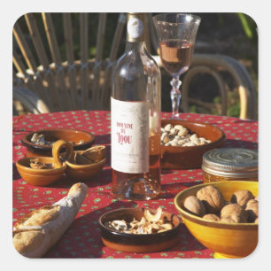 Aperitif and appetizers prepared: bread, olives, square sticker