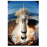 Apollo Saturn V Rocket launch to Moon 1969 Cutout<br><div class="desc">On July 16th, 1969, with the world watching in nervous anticipation, a pillar of fire erupted from Kennedy Space Center. The colossal Saturn V rocket, the most powerful machine ever built at the time, thundered skyward, carrying a spacecraft with three astronauts on a historic journey. The ground trembled, buildings shook,...</div>