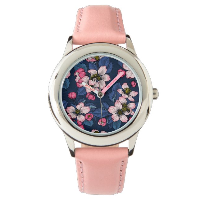 Apple blossom on a dark blue watch (Front)