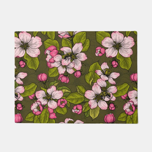 Apple blossom on dark green doormat (Front)