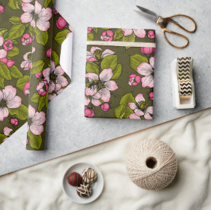 Apple blossom on dark green wrapping paper