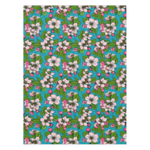 Apple blossom on turquoise tablecloth
