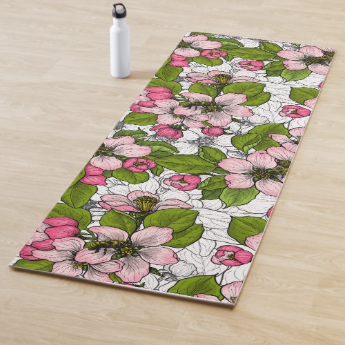 Apple blossom on white yoga mat