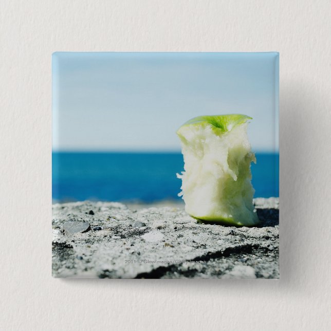 Apple core in the dirt pinback button (Front)