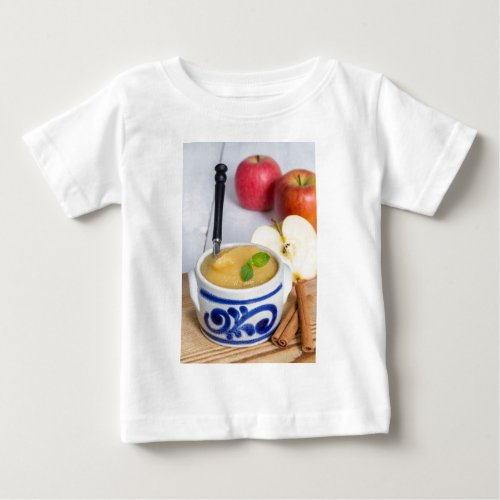 Applesauce with cinnamon in stoneware bowl baby T_Shirt