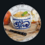 Applesauce with cinnamon in stoneware bowl dartboard with darts<br><div class="desc">Dart Board</div>