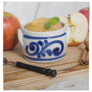 Applesauce with cinnamon in stoneware bowl napkin