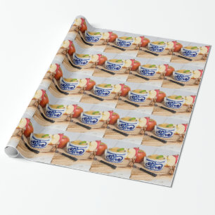 Applesauce with cinnamon in stoneware bowl wrapping paper