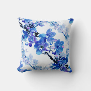 Apricot flowers in blue on a white background. throw pillow