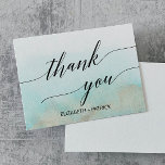 Aqua and Gold Watercolor Beach Thank You Card<br><div class="desc">This aqua and gold watercolor beach thank you card is perfect for a tropical destination wedding. The simple and modern design features stunning turquoise, teal and light blue watercolor with a soft gold sparkle reminiscent of the sand and sea. It's paired with gorgeous elegant calligraphy. The back of the card...</div>
