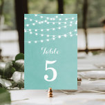 Aqua String Lights Wedding Table Numbers<br><div class="desc">Chic modern summer wedding table number card design with simple elegant glowing string lights hanging across the top and a classy mix of modern and calligraphy script fonts on a printed faux watercolor texture background. A simple and stylish preppy design, perfect for summer! Click the CUSTOMIZE IT button to customize...</div>