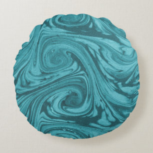 Arched and curved backdrop in tones of turquoise, round pillow