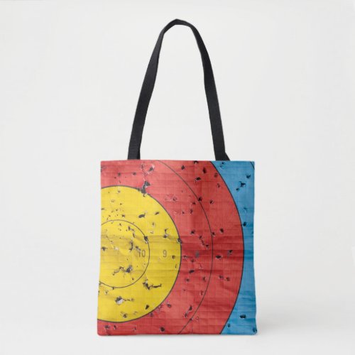 Archery target close up with many arrow holes tote bag