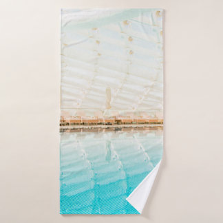 ARCHITECTURAL PHOTOGRAPHY OF AN INDOOR POOL BATH TOWEL