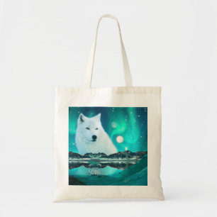 Arctic wolf and magical night with northern lights tote bag