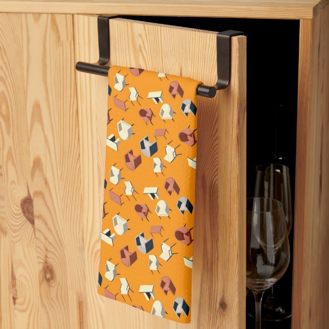armchairs and tables scattered on a bright orange  kitchen towel (Thirds Fold)