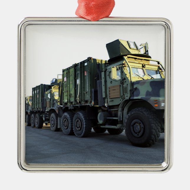 Armored trucks sit on the pier at Morehead City Metal Ornament (Front)