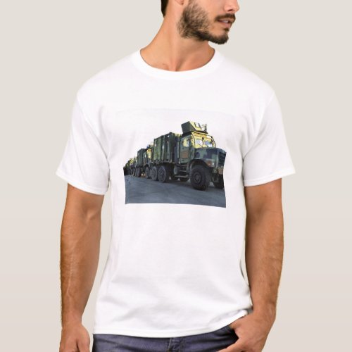 Armored trucks sit on the pier at Morehead City T_Shirt