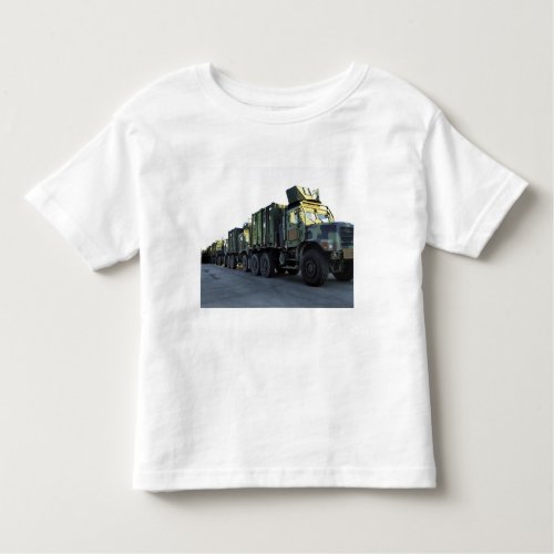 Armored trucks sit on the pier at Morehead City Toddler T_shirt