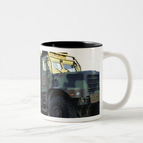 Armored trucks sit on the pier at Morehead City Two_Tone Coffee Mug