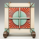 Art Deco Sun and Cross in Coral Teal Ceramic Tile<br><div class="desc">This exquisite tile showcases an Art Deco-inspired design, presenting a harmonious blend of geometric shapes and bold colors. The tile features a stylized sunburst motif in the center, partitioned by clean lines that create a sense of order and symmetry. The palette is a tasteful mix of teal and coral, set...</div>
