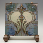 Art Nouveau Elegance Jade Bronze Ceramic Tile<br><div class="desc">Experience the allure of the Art Nouveau movement with this enchanting ceramic tile that artfully fuses jade green and bronze hues. It boasts an elegant, symmetrical design reminiscent of natural forms and structures, a signature of the period. The graceful lines and curves are highlighted in a burnished bronze tone, contouring...</div>