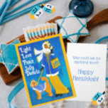 Art Nouveau Retro Hanukkah Greeting Card<br><div class="desc">Done in an art nouveau style illustration, this chic well dressed woman walks her equally well dressed Doodle Dog. She carries a Hanukkah shopping bag and holds a jelly donut in her hand. In the background is an art deco cityscape with gentle snow flurries coming down. This card can be...</div>