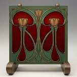Art Nouveau Tulip Tapestry Ceramic Tile<br><div class="desc">This ceramic tile exudes the warmth and splendor of the Art Nouveau period, capturing the essence of its iconic style. Twin tulips in rich shades of amber and gold rise against a striking backdrop of crimson and maroon, their slender stems and curvaceous leaves outlined in elegant aged bronze. The luscious...</div>