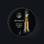 Artemis II Moon Mission Button<br><div class="desc">This Artemis II mission marks to return of humankind to the vicinity of the Moon after a lapse of over 50 years. This 10 day mission will carry four astronauts on a free-return trajectory around the Moon and back to Earth. The spacecraft consists of the NASA SLS Space Launch System...</div>