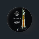 Artemis II Moon Mission Button<br><div class="desc">This Artemis II mission marks to return of humankind to the vicinity of the Moon after a lapse of over 50 years. This 10 day mission will carry four astronauts on a free-return trajectory around the Moon and back to Earth. The spacecraft consists of the NASA SLS Space Launch System...</div>