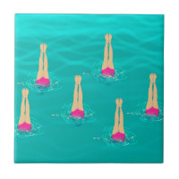 Artistic Swimmers Swimming Under Water